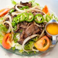 Beef Salad · Roast beef, jalapeño, tomatoes, cilantro, caramelized onions.