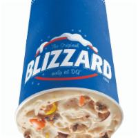 Reese's Pieces Cookie Dough Blizzard Treat · Reese's pieces, chocolate chip cookie dough and peanut butter topping blended with our world...