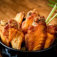 BKK Chicken Wings · 7 piececs. Marinated chicken wings Thai style served with sweet chili sauce.