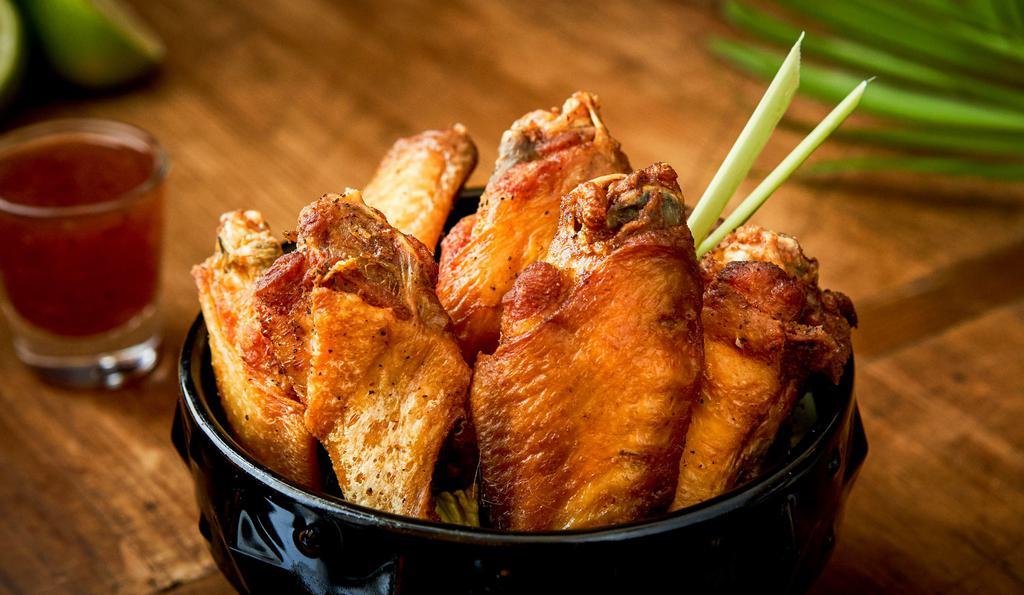 BKK Chicken Wings · 7 piececs. Marinated chicken wings Thai style served with sweet chili sauce.