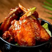 Hot Wings · 7 pieces. Crispy marinated chicken wing Thai style, sauteed with hot sweet chili sauce.