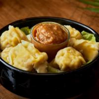 Dumpling in Peanut Sauce · 6 pieces. Steamed chicken dumpling served with our house special peanut sauce.