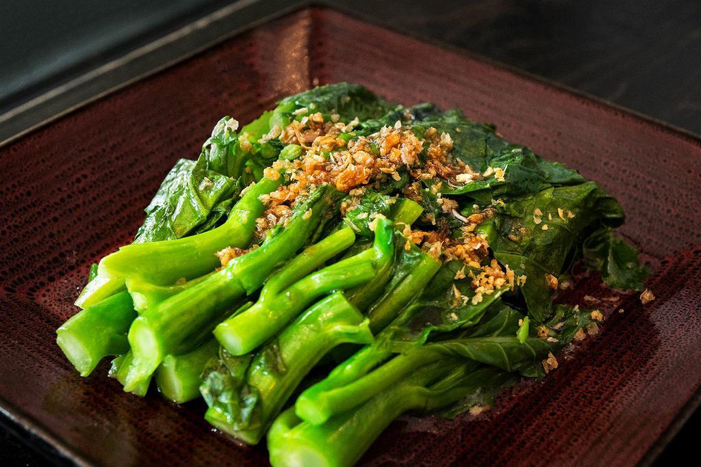 Garlic Chinese Broccoli · Sauteed Chinese broccoli with oyster sauce topped with fried garlic.