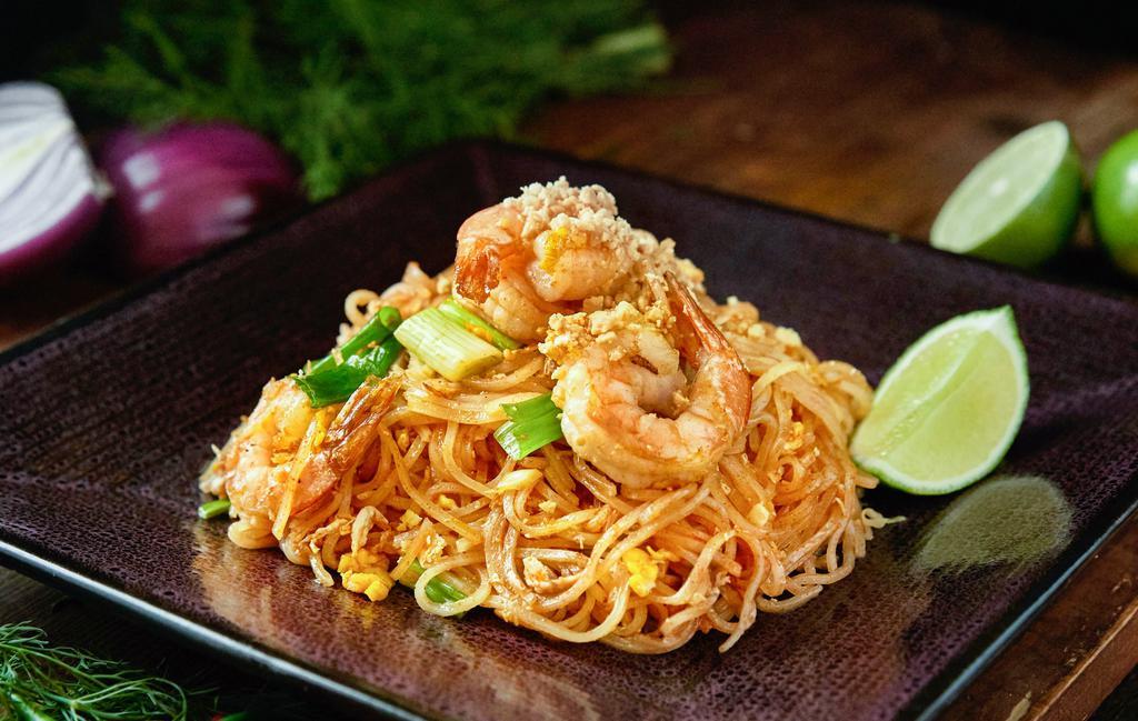 Pad Thai Noodles · Gluten-free. The most famous Thai noodle dish, stir-fried noodle, bean sprout, scallion crunched peanut, and egg in pad Thai sauce.