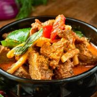Red Curry · Served hot and spicy. Made with bamboo shoot, hot pepper, and basil in coconut milk. Served ...