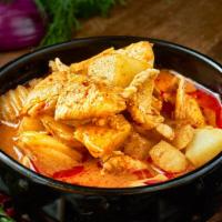 Massaman Curry · Made with potato and onion in coconut milk. Served with white rice. Hot and spicy.