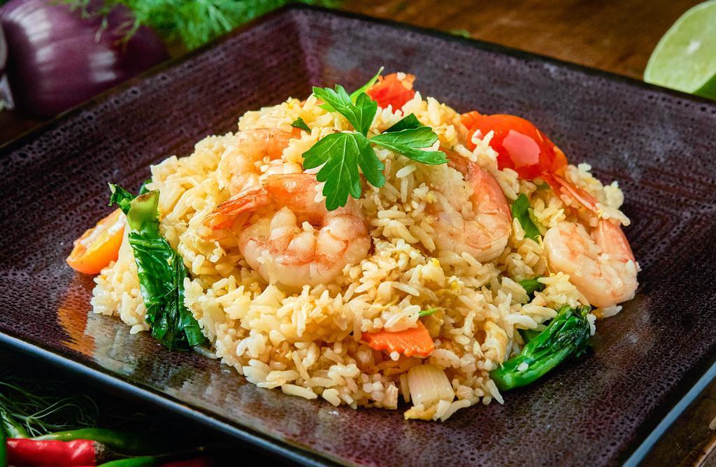 Bangkok Fried Rice · Thai style fried rice with tomatoes, onion, carrot, Chinese broccoli, and egg.