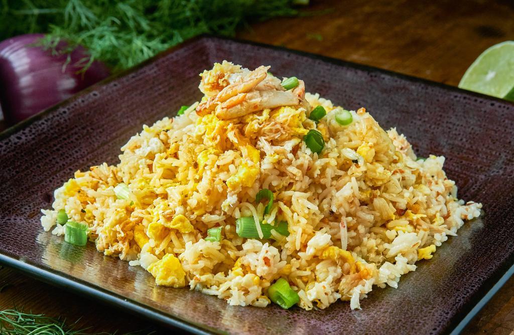 Delightful Crab Meat Fried Rice · Thai style crab meat fried rice with onion, scallion, and egg.