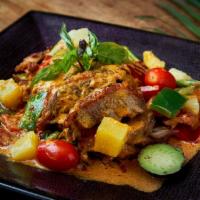 Duck Pineapple Curry · Served hot and spicy. Crispy duck with tomato, pineapple, hot pepper, and basil in red curry...