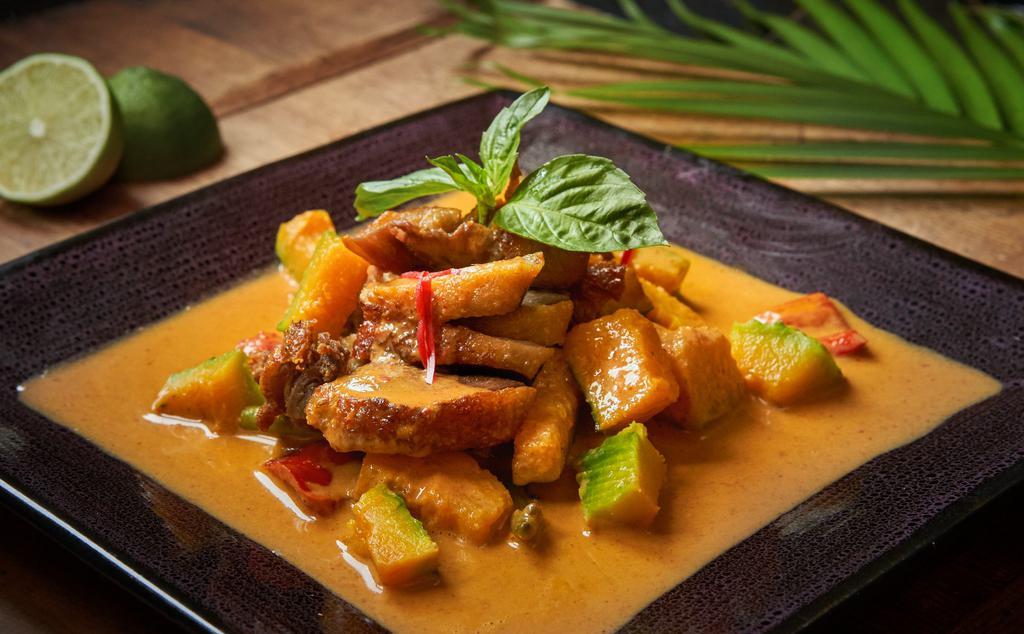 Duck Red Pumpkin · Served hot and spicy. Crispy duck with Asian pumpkin, zucchini, and hot pepper in red curry. Served with white rice.