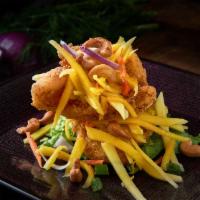 Fish Mango Salad · The famous and most popular dish fried fish topped with mango salad and cashew nut. Served w...