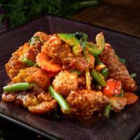 Fish Basil · Served with hot and spicy. Deep fried fish sauteed with hot pepper and onion in chili basil ...