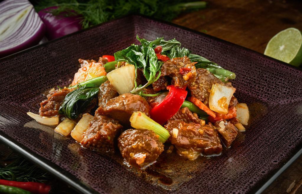 Mock Duck Basil · Served hot and spicy. Crispy mock duck sauteed with hot pepper and onion in chili basil sauce.