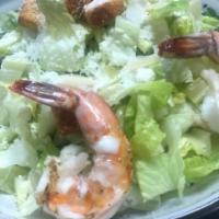 Caesar  Salad · Crisp chopped romaine lettuce topped with garlic croutons, shaved parmesan cheese and classi...