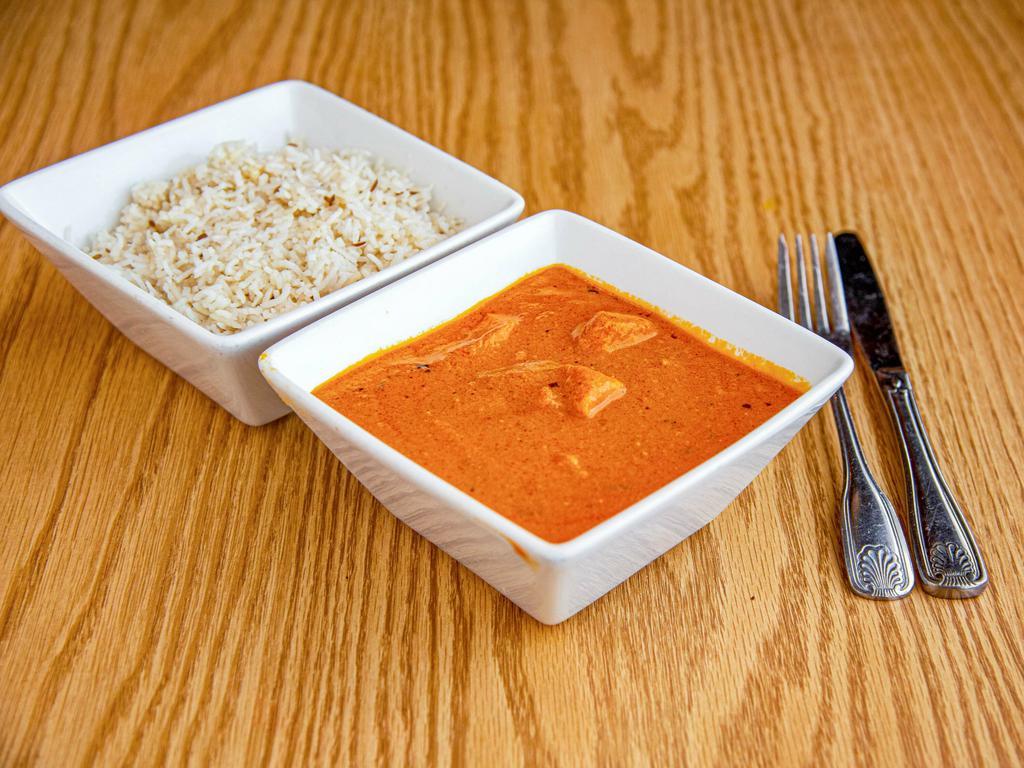 Lamb Tikka Masala · Tender pieces of lamb roasted in our clay oven, folded into a delicately creamy tomatoes sauce.