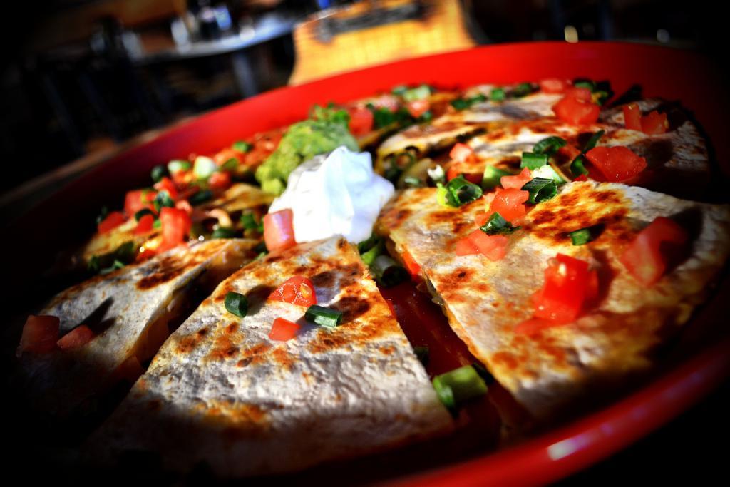 Carne Asada Quesadilla · Flour tortilla with melted Monterey Jack cheese and skirt steak. Garnished with pico de gallo, guacamole and sour cream.