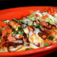 Camarones Apretalados · Bacon wrapped prawns sauteed served with green peppers, onions, mushrooms and topped with Mo...