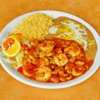 Camarones a Los Diablos · Butterfly prawns with garlic and mushrooms. Served in a special salsa, rice, beans and flour...