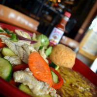 Carnitas de Pollo · Chicken breast sauteed with bell peppers, zucchini, carrots and onions. Served with guacamol...