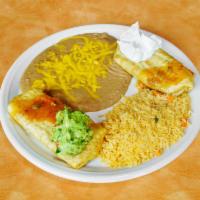 2 Chimichangas Combo · Garnished with cheese, sauce, sour cream and guacamole. Served with rice and choice of refri...