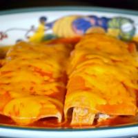 Enchilada · Served with rice, beans, topped with cheese and sauce. Enchilada sauce contains peanut butter.