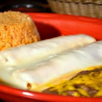 2 Enchiladas a la Crema · Chicken in a cream sauce made with 3 different cheeses and covered with Monterey Jack cheese...