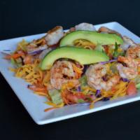 GRILLED SHRIMP SALAD · Lettuce, carrots, red cabbage, cheese with grilled prawns on top.  Served with dressing of y...