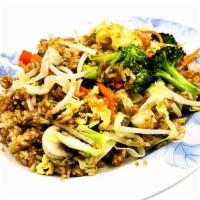 Vegetable Fried Rice · Medley of fresh vegetables lightly tossed in our hot iron wok with scrambled eggs and fried ...
