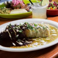 Azteca Enchiladas · Delicately slow cooked beef short rib and melted Oaxaca cheese. Topped with our homemade gre...