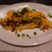 Loaded Hash Brown · Topped with Cheddar Cheese, Bacon, Onions and Sour Cream