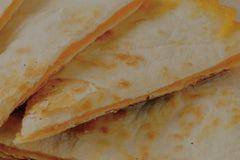 Quesapita · Grilled pita with cheese.