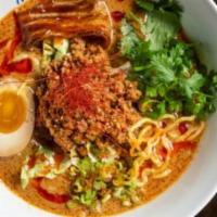 Spicy Tan Tan Ramen · Sesame curry broth, miso ground pork, cilantro and ajitama