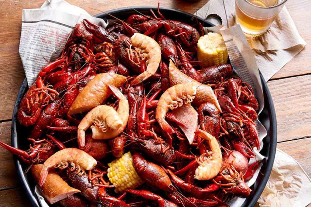 Ultimate Cajun Platter · 3 pounds boiled Louisiana crawfish, 1/2 dozen boiled shrimp, sausage, fresh corn & red potatoes, mushrooms and onions all packed up and ready to geaux in a reusable thermal bag!