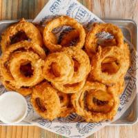 Hand Breaded Onion Rings · Hand breaded onion rings served with ranch