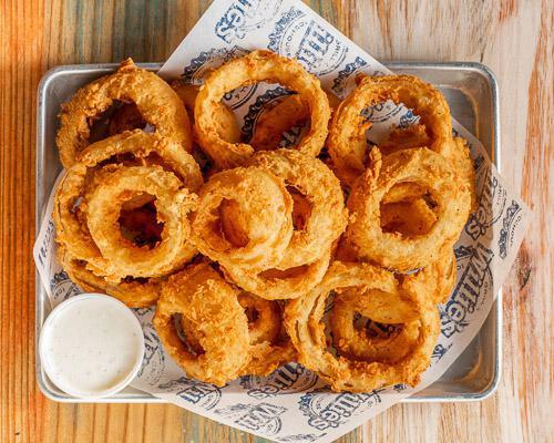 Hand Breaded Onion Rings · Hand breaded onion rings served with ranch