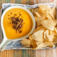 Icehouse Queso · Chips and queso with ground beef