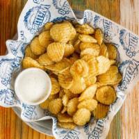 Fried Pickles · Hand breaded fried pickles served with ranch