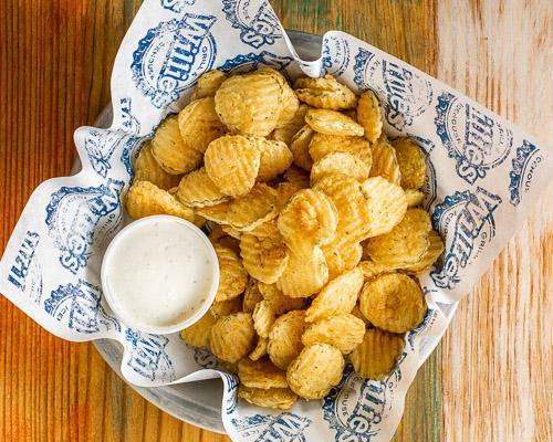 Fried Pickles · Hand breaded fried pickles served with ranch