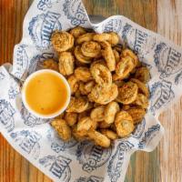 Fried Jalapenos · Hand breaded fried jalapenos served with queso