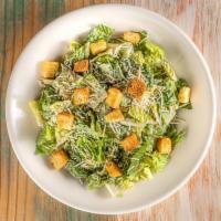 Caesar Salad · Romaine lettuce, shredded Parmesan cheese, and croutons topped with Caesar dressing