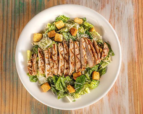 Caesar Salad with Chicken · Romaine lettuce, shredded Parmesan cheese, and croutons topped with choice of grilled, fried, or blackened chicken and Caesar dressing