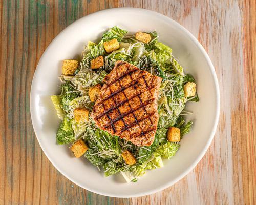 Caesar Salad with Salmon · Romaine lettuce, parmesan cheese, and croutons. Topped with your choice of grilled or blackened salmon and caesar dressing
