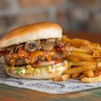 Icehouse Burger · Half pound certified Angus beef patty, cooked medium well topped with cheese, bacon, mushroo...