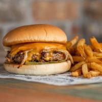 Hickory Cheddar Burger · Half pound certified Angus beef patty, cooked medium well topped with cheddar cheese, pickle...