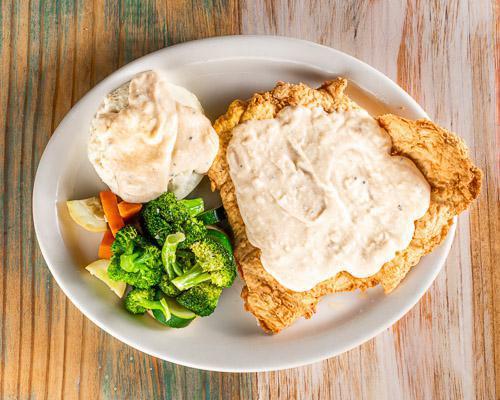 Chicken Fried Chicken · Chicken fried chicken smothered in cream gravy served with choice of two sides.