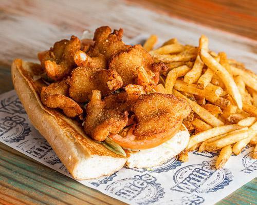 Shrimp Po-Boy · Grilled, fried or blackened shrimp served on hoagie roll with lettuce and tomato, and served with choice of side.