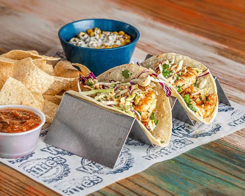 Baja Shrimp Taco · Grilled, fried or blackened gulf shrimp with cabbage slaw and chipotle mayo on corn tortillas served with choice of two sides.