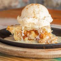 Apple Sizzler · Apple pie topped with vanilla ice cream, brandy butter sauce, and cinnamon.