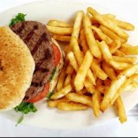 X-Tudo Burger · Lettuce, tomatoes, fried egg, bacon, ham, pickle, corn and mayo.