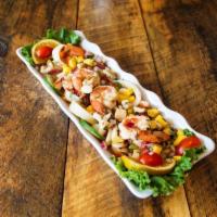 Ceviche Mixto · Mixed seafood ceviche served with Chiflez.